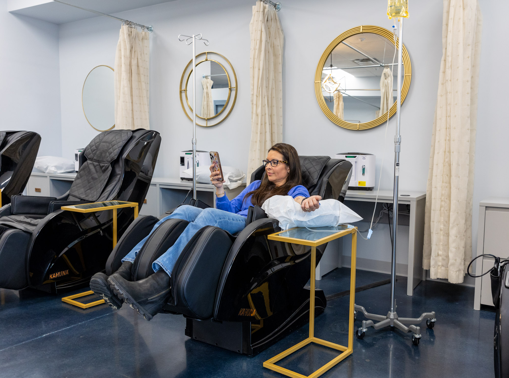 A woman relaxes while receiving IV hydration near Brentwood, TN