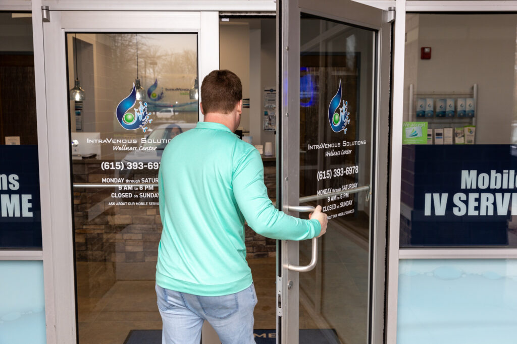 A man opens the door to an IntraVenous Solutions office to receive an immune system booster in Hendersonville, TN