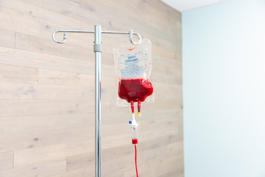 An infusion bag filled with the ozone infusion hangs from an IV pole in IntraVenous Solutions. Ozone therapy provides benefits for anti-aging treatments in Franklin, TN.